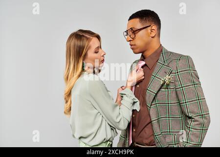A man and a woman in a loving embrace, posing gracefully for a portrait. Stock Photo