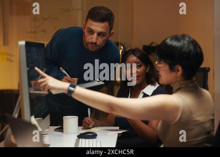 Group of developers working on new project together Stock Photo