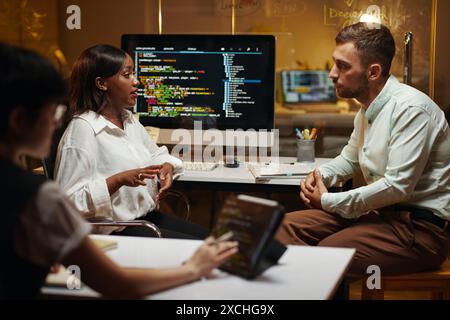 Team of software developers working on big project Stock Photo