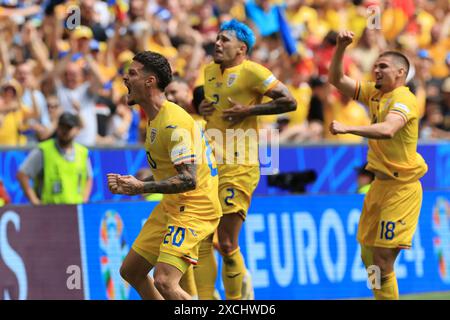 Munich Football Arena, Munich, Germany. 17th June, 2024. Euro 2024 Group E Football, Romania versus Ukraine; Romania's Dennis Man reacts to going ahead 1-0 in the 29th minute with Andrei Ratiu and Razvan Marin Credit: Action Plus Sports/Alamy Live News Stock Photo