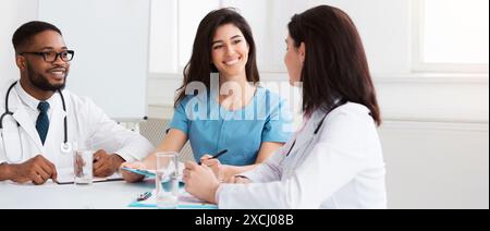 Intern with mentor talking and discussing questions Stock Photo