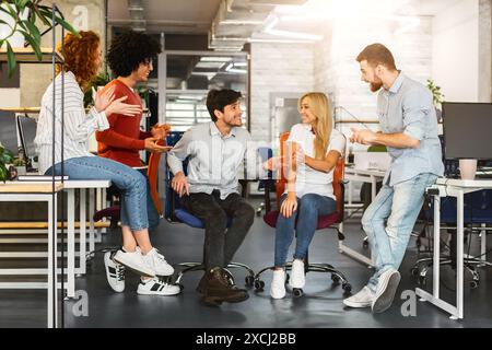 Diverse Professionals Employees Strategizing at Open-Plan Workspace Stock Photo