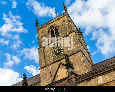 The clock tower on St Johns Church in Knaresborough North Yorkshire England UK. The clock face was erected in 1884 and the church is 12th century. Stock Photo