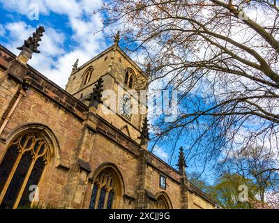 The clock tower on St Johns Church in Knaresborough North Yorkshire England UK. The clock face was erected in 1884 and the church is 12th century. Stock Photo