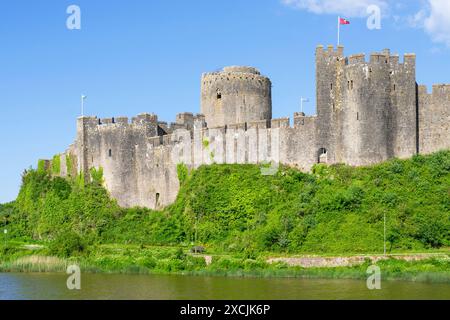 Pembroke castle wall and moat Pembroke Pembrokeshire Wales UK GB Europe - Castell Penfro Stock Photo