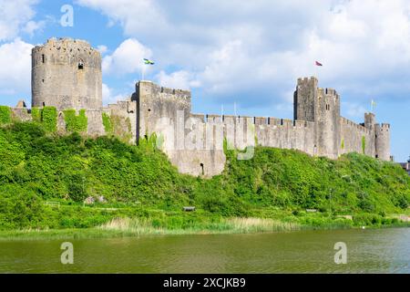 Pembroke castle wall and moat Pembroke Pembrokeshire Wales UK GB Europe - Castell Penfro Stock Photo