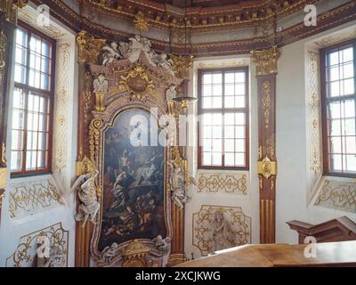 Wien, Austria - July 28, 2023: This Belvedere Chapel is quite stunning with the beautiful decoration of chandeliers, arts and painting on the ceiling. Stock Photo