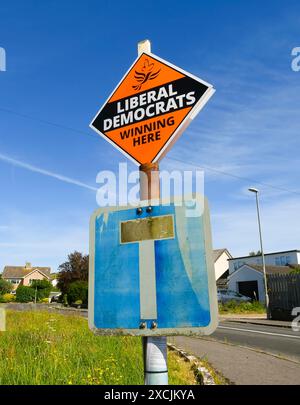 West Bay, Dorset, UK.  17th June 2024.  General Election - A Liberal Democrats “Winning Here” election campaign sign has been unwittingly placed above a dead end road sign at West Bay in Dorset.  A metaphor for their chances of winning the general election?  Picture Credit: Graham Hunt/Alamy Live News Stock Photo