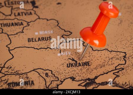 Red Pin Marking Ukraine on Map Stock Photo