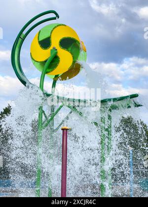 Giant Water Bucket Splash at Children's Water Park Stock Photo