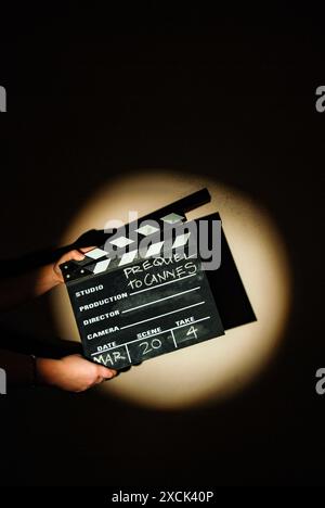 Hands holding a clapperboard Stock Photo