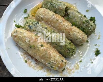 Spinach dumplings and cheese dumplings on a plate Stock Photo