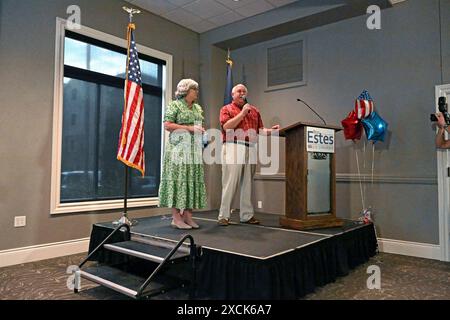 WICHITA, KANSAS - JUNE 15, 2024 Congressman Ron Estes (R-KS) stands with his wife Susan Estes on stage during a fundraiser rally in his bid for re-election to the 4th congressional seat. Stock Photo