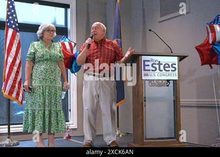 WICHITA, KANSAS - JUNE 15, 2024 Congressman Ron Estes (R-KS) stands with his wife Susan Estes on stage during a fundraiser rally in his bid for re-election to the 4th congressional seat. Stock Photo