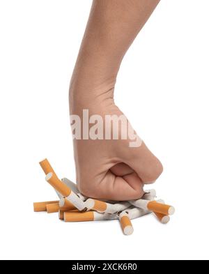 Stop smoking. Man crushing cigarettes on white background, closeup Stock Photo