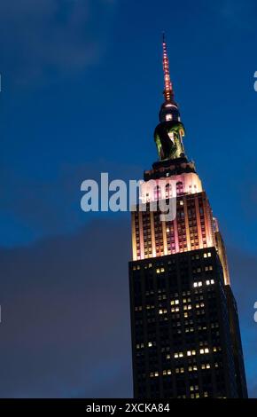 Giant Dragon balloon curls around the Empire State Building advertising ...