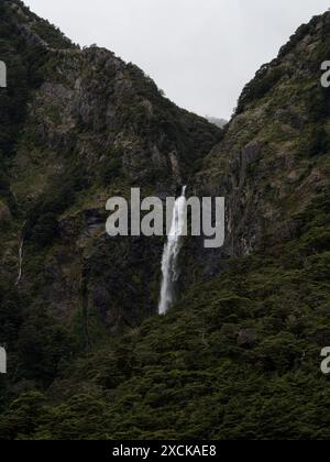 Devil's Punchbowl Falls roaring waterfall in lush green beech forest vegetation at Arthur's Pass Canterbury Southern Alps South Island New Zealand Stock Photo