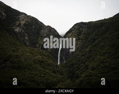 Devil's Punchbowl Falls roaring waterfall in lush green beech forest vegetation at Arthur's Pass Canterbury Southern Alps South Island New Zealand Stock Photo