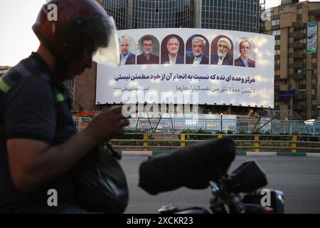 Tehran, Iran. 17th June, 2024. A billboard displaying the faces of the six candidates in the upcoming Iranian presidential election in Valiasr Square in downtown Tehran. Iran is holding a new presidential election on June 28 following the death of President Ebrahim Raisi and seven others in a helicopter crash. Iran's Guardian Council on June 9 approved the country's hard-line parliament speaker and five others to run in the country's presidential election. (Credit Image: © Rouzbeh Fouladi/ZUMA Press Wire) EDITORIAL USAGE ONLY! Not for Commercial USAGE! Stock Photo