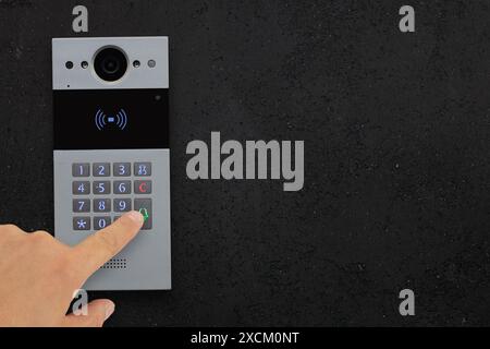 Hand Pressing Doorbell Keypad, Intercom Stock Photo