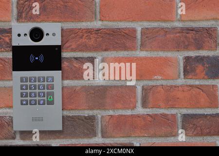 Doorbell Intercom on Brick Wall Stock Photo
