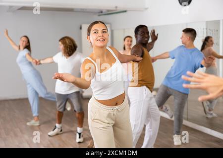 Adult couples dancing active dance together in studio Stock Photo