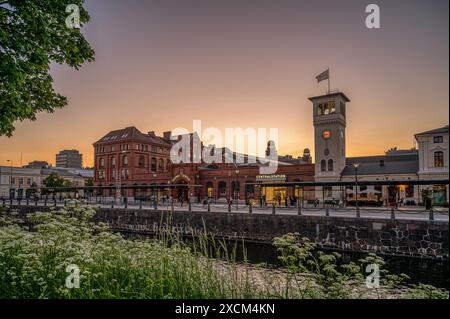 Malmö central station with grass in the foreground in the twilight hour, Malmö, Sweden, June 17, 2024 Stock Photo