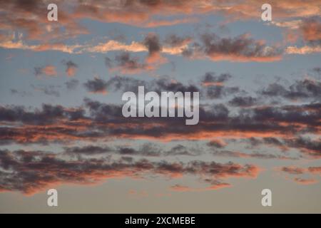 Orange, gray, white, black dramatic clouds. Stock Photo