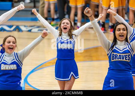 The Blackhawk Christian High School cheerleaders perform a routine during a game at Lakewood Park Christian High School near Auburn, Indiana, USA. Stock Photo