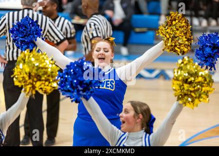 The Blackhawk Christian High School cheerleaders perform a routine during a game at Lakewood Park Christian High School near Auburn, Indiana, USA. Stock Photo