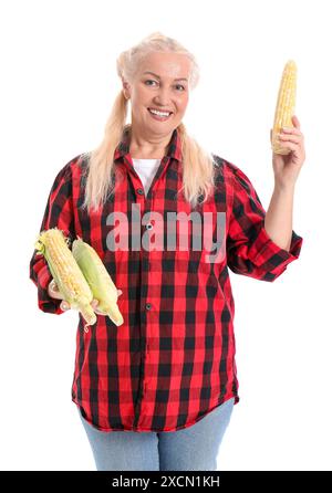 Mature female farmer with ripe corn cobs isolated on white background Stock Photo