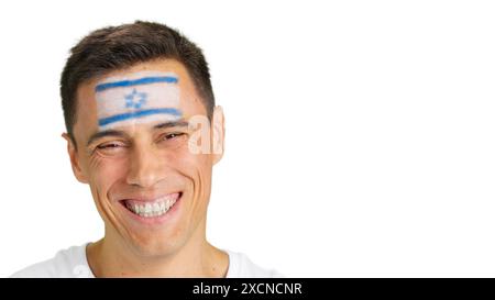 Man with a israeli flag painted on the face smiling Stock Photo