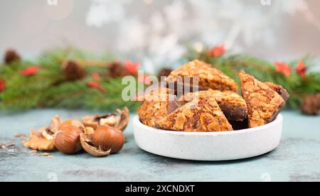 Nut corner triangles, traditional german sweets called Nussecke, covered with chocolate, christmas cake Stock Photo