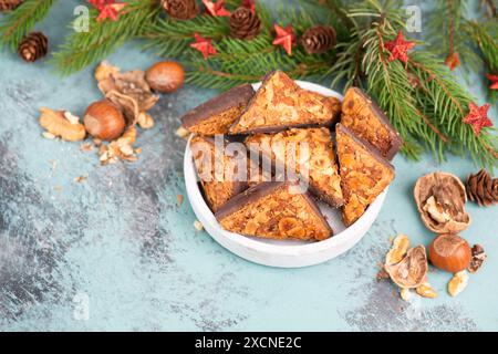 Nut corner triangles, traditional german sweets called Nussecke, covered with chocolate, christmas cake Stock Photo