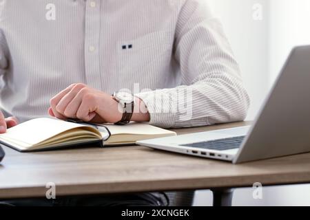 businessman looking at classic wristwatch, time management concept Stock Photo