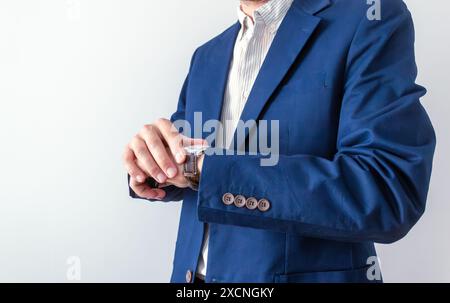 businessman looking at classic wristwatch, time management concept Stock Photo