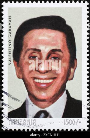 Fashion designer Valentino Garavani on stamp from Tanzania Stock Photo