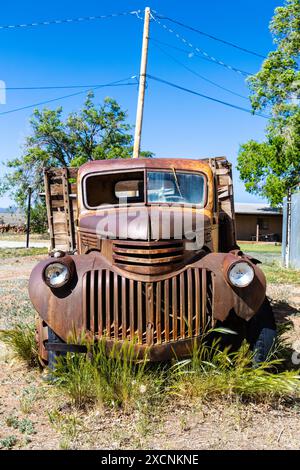 Rusty 1940s vintage Chevrolet pickup truck at the ruins of Allen's Garage built in the 1950s along the historic Route 66, Blue Water, New Mexico, USA Stock Photo