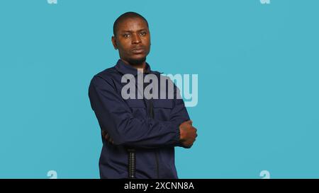Security guard doing salute hand gesture, preparing to start job of ...