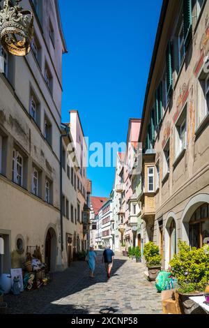 Lindau, Germany, June 14, 2023, Beautiful colorful old town houses and streets of the city at bodensee with blue sky and tourists visiting the city Stock Photo