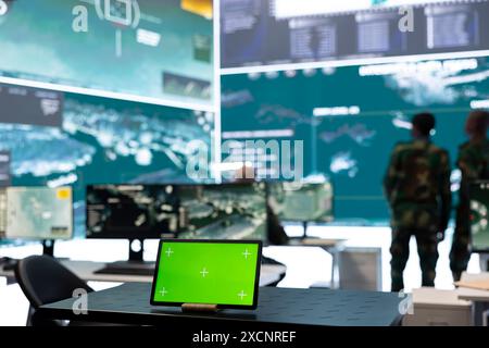Military staff monitoring real time battlefield operation from CCTV ...