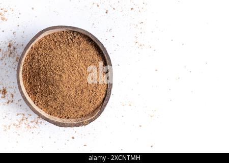 Coconut palm sugar in coconut bowl isolated on white background Stock Photo