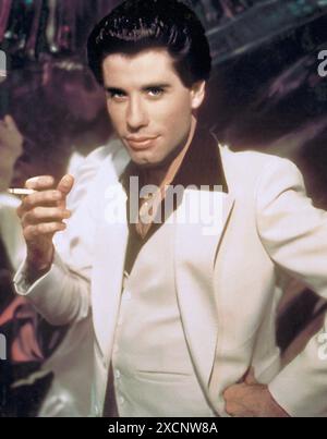 Saturday Night Fever  Year: 1977 USA  Director: John Badham  John Travolta  Restricted to editorial use. See caption for more information about restrictions.  It is forbidden to reproduce the photograph out of context of the promotion of the film. It must be credited to the Film Company and/or the photographer assigned by or authorized by/allowed on the set by the Film Company. Restricted to Editorial Use. Photo12 does not grant publicity rights of the persons represented. credit:Photo12/7e Art/Paramount Pictures Stock Photo