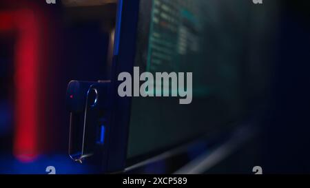 Hacker inserting USB in computer after managing to steal sensitive data, close up. Scammer uploading storage drive into PC after obtaining sensitive information from users using malware, camera B Stock Photo
