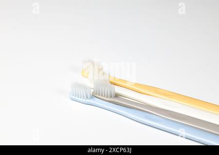 modern colorful Disposable toothbrushes isolated on white background. Taking care of teeth, dental concept. Stock Photo