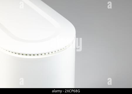 Close up dual band wi-fi 6 router on white table. Stock Photo