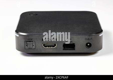 multiple ports or connectors LAN, HDMI, SPDIF of tiny computer or multimedia box or android box isolate on white background. Stock Photo