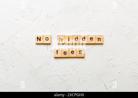 no hidden fees word written on wood block. no hidden fees text on table, concept. Stock Photo