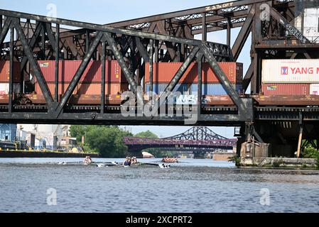 Rowing shells pass under a pair of bascule trunnion railway bridges known as the Pennsylvania Railroad Eight Track on Chicago's South Side. Stock Photo