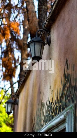 Street lamp on a painted old wall. Stock Photo